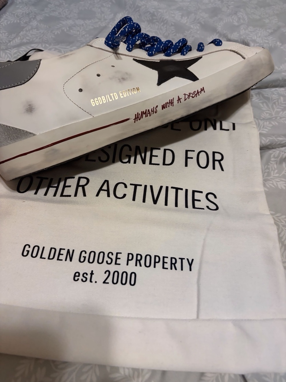 Golden Goose White Leather Low-Top Sneaker with Black Star and Blue Laces